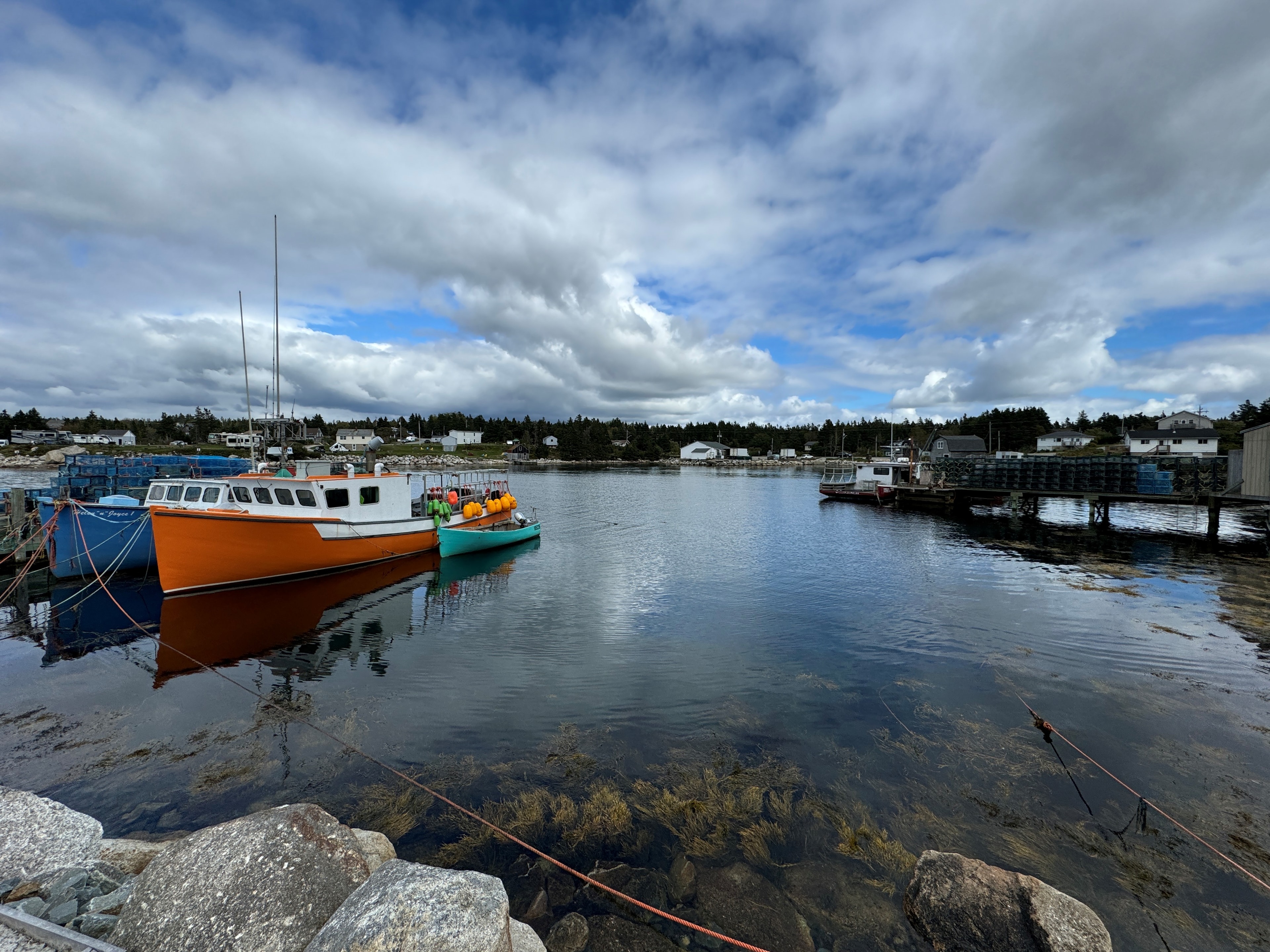 Colourful fishing boats moored in a Nova Scotia cove