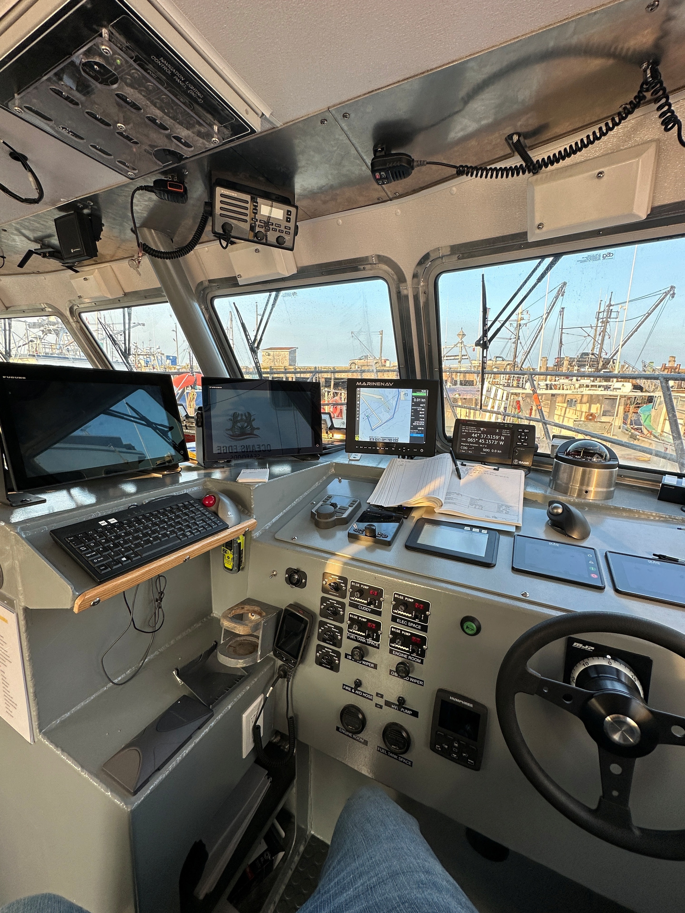 Modern fishing vessel wheelhouse with full electronics suite installed