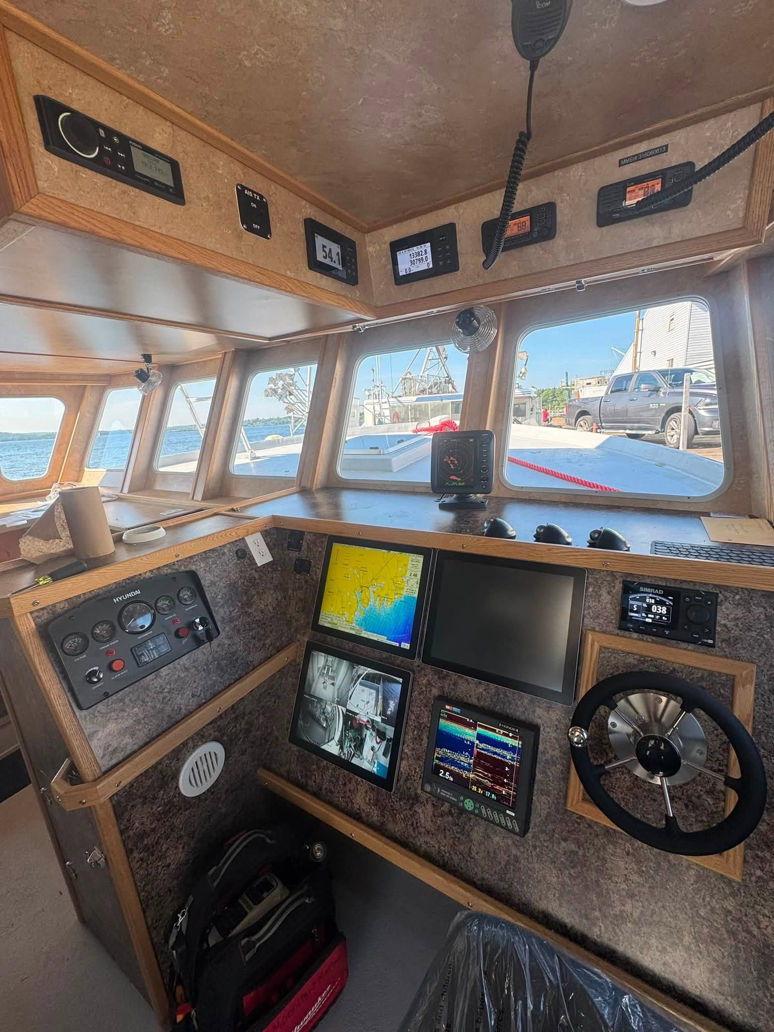 Vessel wheelhouse with Furuno and Simrad marine electronics installed